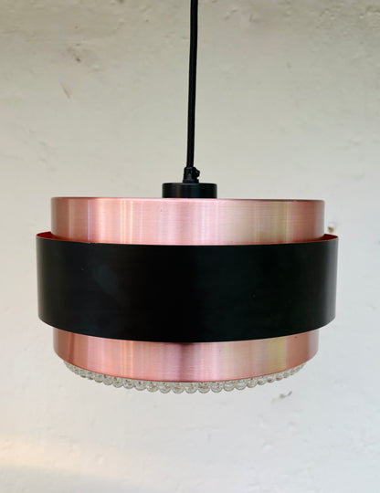 Iconic Saturn pendant in copper and black metal
