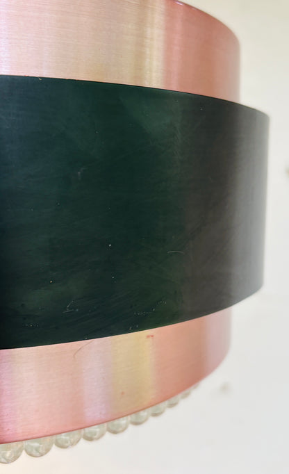 Iconic Saturn pendant in copper and black metal