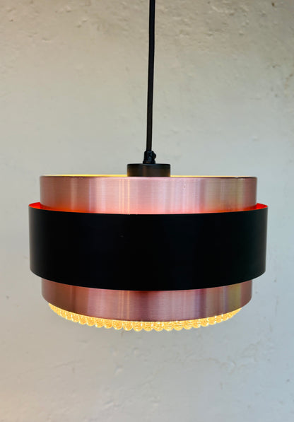 Iconic Saturn pendant in copper and black metal