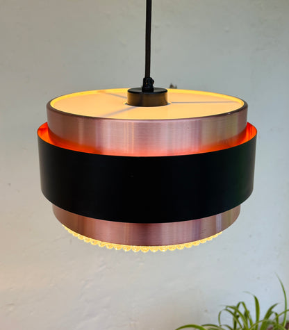 Iconic Saturn pendant in copper and black metal