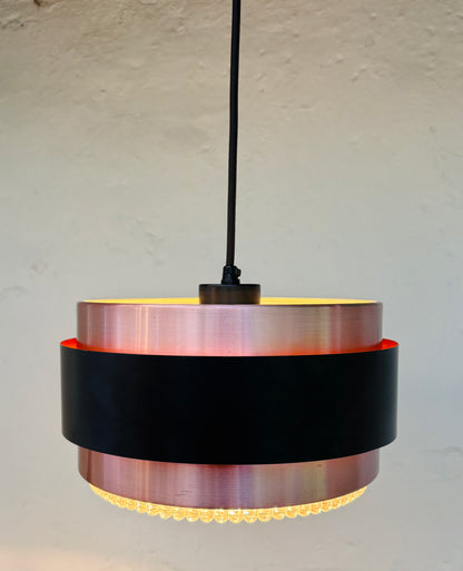 Iconic Saturn pendant in copper and black metal
